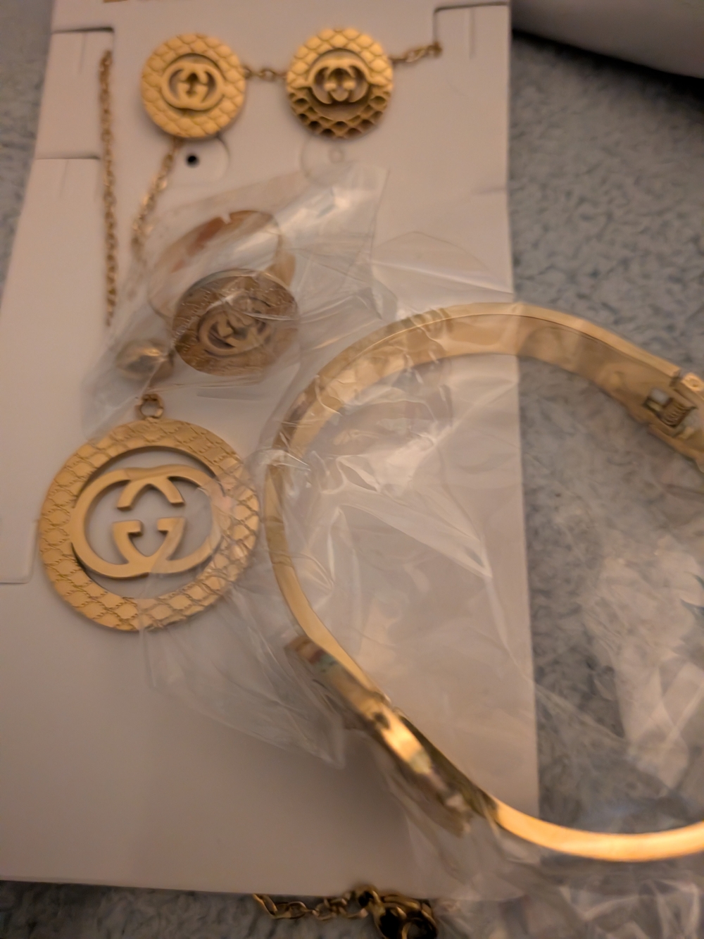 Four PieceGold Tone Interlocking G Pendant Necklace & Bracelet Set